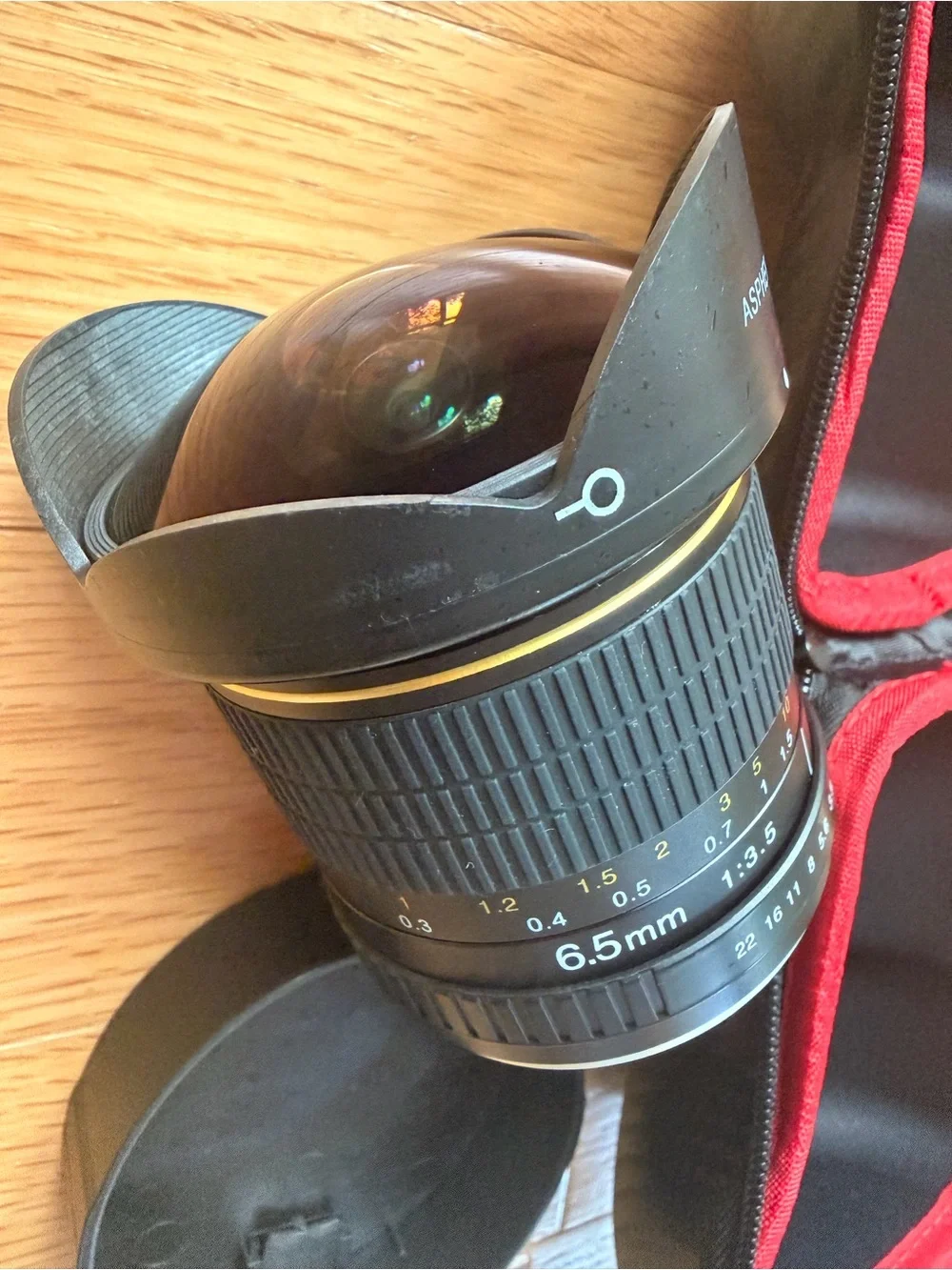 Opteka fish eye camera lens with case and camera lens organization backpack.